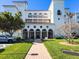 Building entrance with walkway and lush landscaping at 11200 Hacienda Del Mar Blvd # 201, Placida, FL 33946
