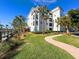 Building exterior showcasing Mediterranean style and landscaping at 11200 Hacienda Del Mar Blvd # 201, Placida, FL 33946