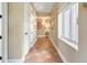 Light-filled hallway with tile floors and nautical decor at 11200 Hacienda Del Mar Blvd # 201, Placida, FL 33946