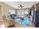 Spacious living room with comfy seating, large windows, and a beautiful rug at 11200 Hacienda Del Mar Blvd # 201, Placida, FL 33946