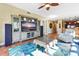 Living room features a large TV, comfortable seating, and a view into the kitchen at 11200 Hacienda Del Mar Blvd # 201, Placida, FL 33946