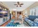 Open concept living room with access to the balcony and kitchen at 11200 Hacienda Del Mar Blvd # 201, Placida, FL 33946