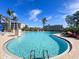 Large freeform swimming pool with surrounding patio at 11200 Hacienda Del Mar Blvd # 201, Placida, FL 33946