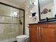 Bathroom with walk-in shower, tile surround and a floating vanity at 13100 S Mccall Rd # 110, Port Charlotte, FL 33981