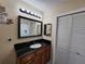Bathroom with dark vanity and updated fixtures at 13100 S Mccall Rd # 110, Port Charlotte, FL 33981