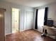 Bedroom with built-in closet and adjacent bathroom at 13100 S Mccall Rd # 110, Port Charlotte, FL 33981