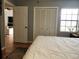 Bedroom with king bed, access to living room, and ample closet space at 13100 S Mccall Rd # 110, Port Charlotte, FL 33981