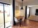 Small dining area with sliding door access to patio at 13100 S Mccall Rd # 110, Port Charlotte, FL 33981
