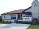 Front view of a single-story villa, showing well-maintained landscaping at 13100 S Mccall Rd # 110, Port Charlotte, FL 33981