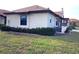Exterior of a single-story home with a manicured lawn at 13100 S Mccall Rd # 110, Port Charlotte, FL 33981