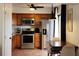 Modern kitchen with stainless steel appliances and wood cabinets at 13100 S Mccall Rd # 110, Port Charlotte, FL 33981