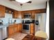 Updated kitchen with stainless steel appliances and wood cabinets at 13100 S Mccall Rd # 110, Port Charlotte, FL 33981