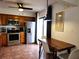 Eat-in kitchen features stainless steel appliances and wood cabinets at 13100 S Mccall Rd # 110, Port Charlotte, FL 33981