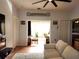 Open concept living room with sunroom access and tiled floors at 13100 S Mccall Rd # 110, Port Charlotte, FL 33981