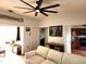 Living room with off-white sectional sofa and ceiling fan at 13100 S Mccall Rd # 110, Port Charlotte, FL 33981