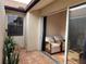 Private tiled patio with potted plants and access from sunroom at 13100 S Mccall Rd # 110, Port Charlotte, FL 33981