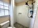 Updated shower with subway tile, pebble floor, and a rainfall shower head at 13100 S Mccall Rd # 110, Port Charlotte, FL 33981