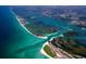 Breathtaking aerial view of coastline, islands, and waterways at 1471 Deer Creek Dr, Englewood, FL 34223