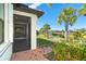 Private backyard oasis with pond view, lush landscaping, and brick patio at 1506 Hyssop Loop, North Port, FL 34289
