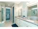 Elegant bathroom with double vanity, granite countertop, and walk-in shower at 1506 Hyssop Loop, North Port, FL 34289