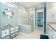 Spa-like bathroom with a large glass shower, walk-in closet, and modern vanity at 1506 Hyssop Loop, North Port, FL 34289