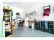 Organized garage workshop with ample storage shelving at 1506 Hyssop Loop, North Port, FL 34289