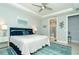 Bright main bedroom with king-size bed and en-suite bathroom access at 1506 Hyssop Loop, North Port, FL 34289