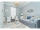 Home office with a desk, daybed, and coastal decor at 1506 Hyssop Loop, North Port, FL 34289