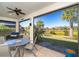 Enjoy meals in this screened lanai with table and chairs, overlooking a pond at 1506 Hyssop Loop, North Port, FL 34289