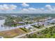 Aerial perspective showcasing a neighborhood with water access and various houses at 15228 Chinook Way, Port Charlotte, FL 33981