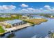 Aerial view of waterfront property with private dock and canal access at 15228 Chinook Way, Port Charlotte, FL 33981