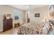 Charming bedroom featuring a floral comforter and plenty of natural light at 15228 Chinook Way, Port Charlotte, FL 33981