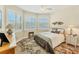 Bright bedroom with a queen-size bed and window seating at 15228 Chinook Way, Port Charlotte, FL 33981
