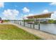 Private boat lift with a covered walkway, providing convenient water access at 15228 Chinook Way, Port Charlotte, FL 33981