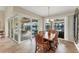 Bright dining room with sliding doors leading to a patio and pool at 15228 Chinook Way, Port Charlotte, FL 33981
