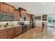 Modern kitchen featuring stainless steel appliances and ample cabinetry at 15228 Chinook Way, Port Charlotte, FL 33981