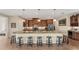 Spacious kitchen with granite countertops, large island, and stainless steel appliances at 15228 Chinook Way, Port Charlotte, FL 33981