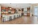 Modern kitchen with an island, ample cabinetry, and breakfast bar seating at 15228 Chinook Way, Port Charlotte, FL 33981