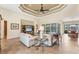 Spacious living room with high ceilings, tile flooring, and access to the pool area at 15228 Chinook Way, Port Charlotte, FL 33981