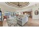 Open living room with a view of the kitchen, dining area and pool at 15228 Chinook Way, Port Charlotte, FL 33981