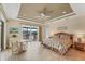 Main bedroom with water views and access to a private patio at 15228 Chinook Way, Port Charlotte, FL 33981
