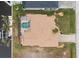Overhead view of a house with pool and canal access at 15626 Meacham Cir, Port Charlotte, FL 33981
