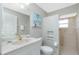 Bathroom with walk-in shower and updated vanity at 15626 Meacham Cir, Port Charlotte, FL 33981