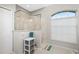 Clean bathroom with a walk-in shower and modern fixtures at 15626 Meacham Cir, Port Charlotte, FL 33981