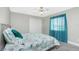 Bedroom with teal bedding and tiled floors at 15626 Meacham Cir, Port Charlotte, FL 33981