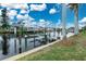 Private dock with boat lift and serene canal views at 15626 Meacham Cir, Port Charlotte, FL 33981