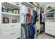 Spacious walk-in closet with custom shelving and rods at 15626 Meacham Cir, Port Charlotte, FL 33981
