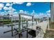 Private dock with boat lift offering convenient water access at 15626 Meacham Cir, Port Charlotte, FL 33981