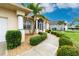 Landscaped walkway leading to the front entrance at 15626 Meacham Cir, Port Charlotte, FL 33981