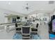 Game room features shuffleboard, poker table, and arcade game at 15626 Meacham Cir, Port Charlotte, FL 33981
